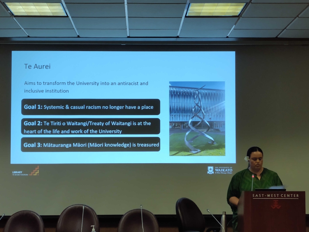 Rangihuria McDonald presents a slide on Te Aurei, the University of Waikato's commitment to anti-racism.