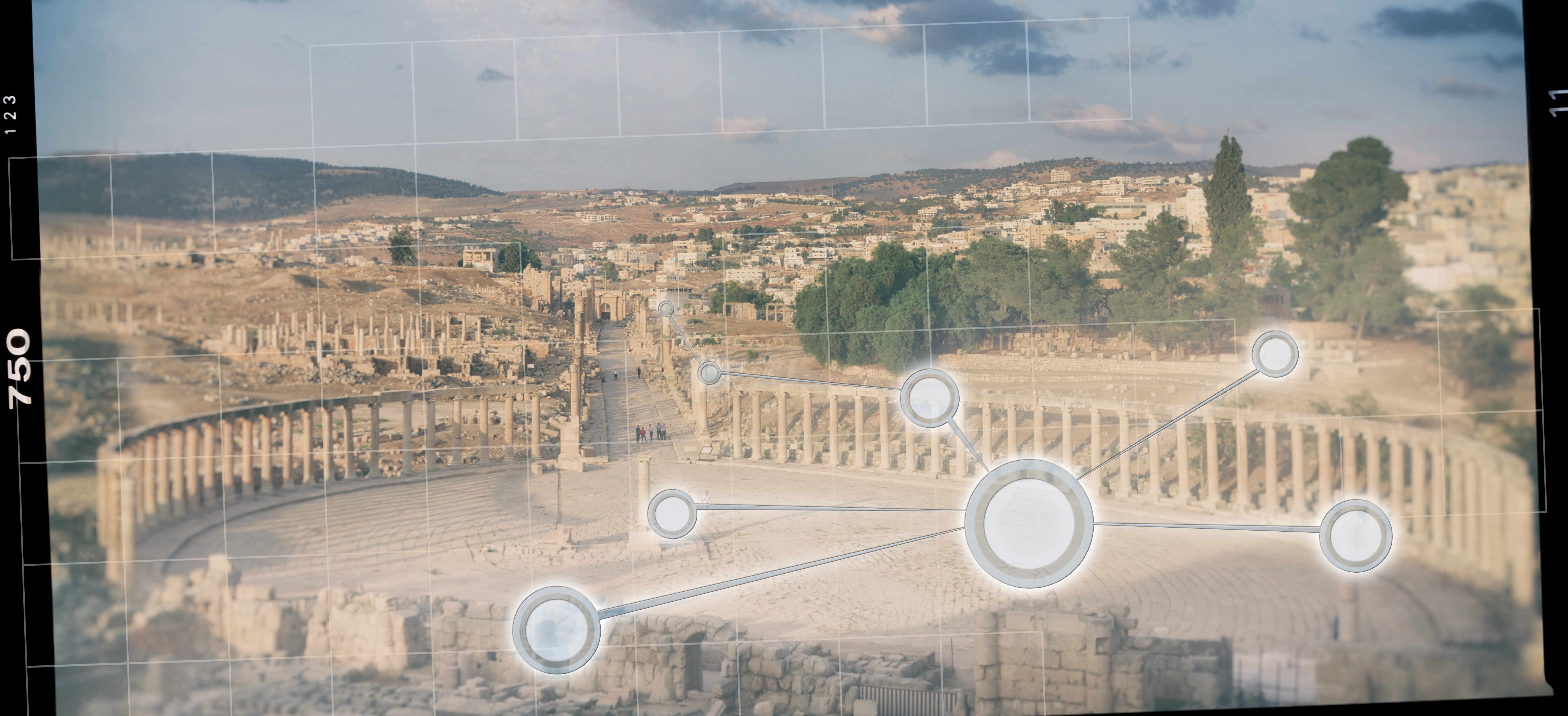 An expansive view of ancient ruins and modern city with buildings in Jerash, with focus points overlaid