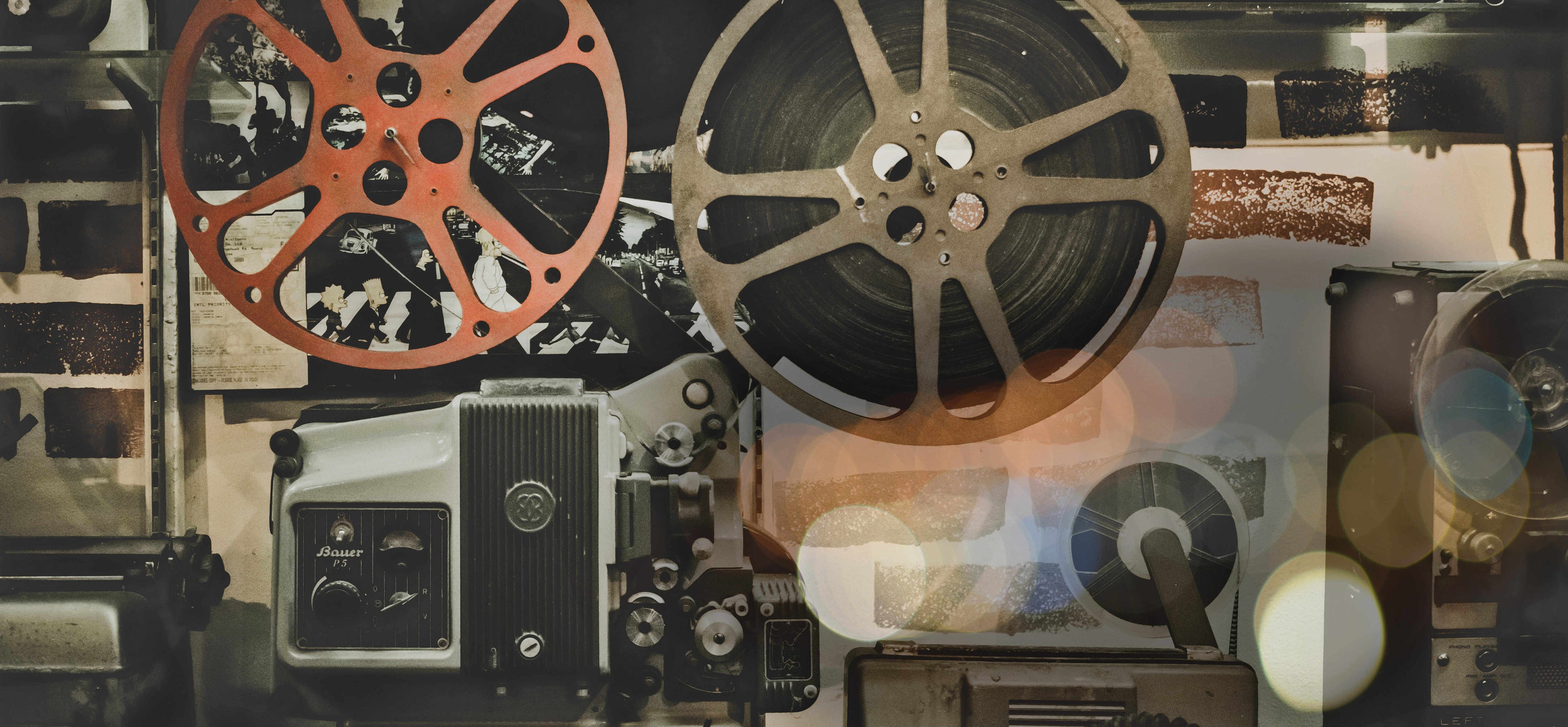 A vintage movie reel and film reel are showcased, evoking nostalgia for the golden age of cinema.